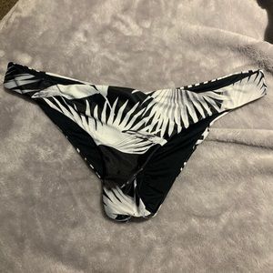 Reversible Hawaiian and black bikini bottoms